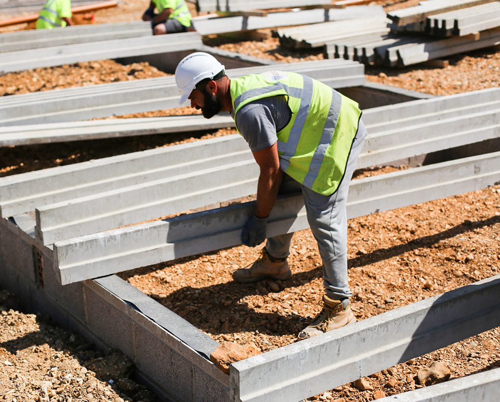 Mackoy Groundworks Operative Moving Beams into right Position for further Oversite Work