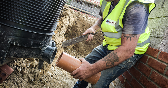 Civil Engineering Services Taken Out by Mackoy Groundworker Installing Pipes