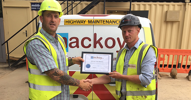 Hand over Mackoy Ltd May Site Manager and Site of the Month Award