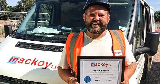 June Site of the Month Award Winner for Mackoy Ltd Groundworks and Civil Engineering in Front on Branded Van