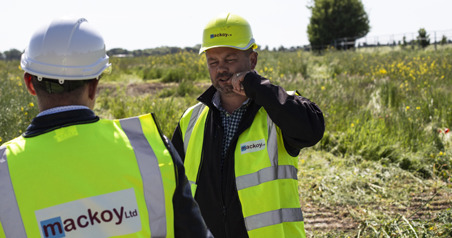 Mackoy Construction Director in discussion on Groundworks Site Clearance site