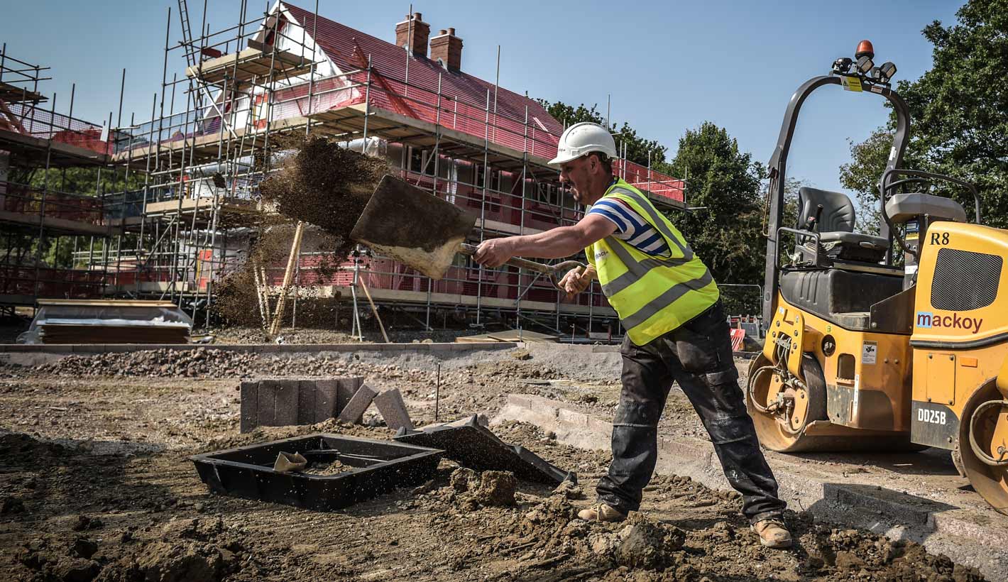 Groundworks Operative shovelling earth aside